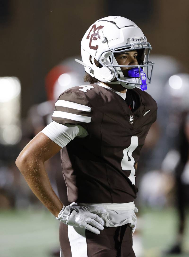 Mt. Carmel's Quentin Burell (4) looks to the sideline for a play during the varsity football game between Nazareth Academy and Mt. Carmel high school on Friday, Sep. 13, 2024 in Chicago.