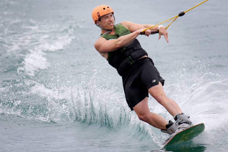 Evan Walters of Schaumburg shreds some water during a Beers, Burgers, Brats and Bands event for Father's Day at the Quarry Cable Park on Sunday, June 20, 2021, in Crystal Lake.