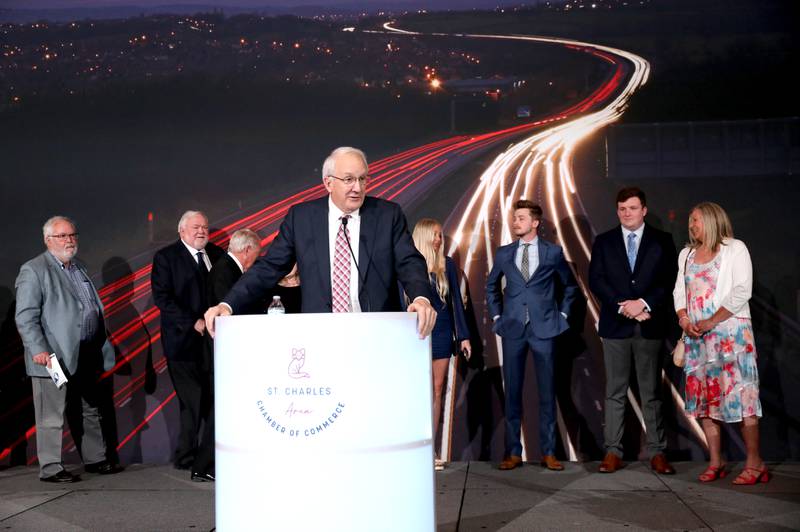 Jim Cooke, who serves as a St. Charles Park District commissioner, is surrounded by family and friends as he accepts the Charlamagne Award during the 55th Annual Charlemagne Awards Dinner at the Q Center in St. Charles on Friday, May 19, 2023.