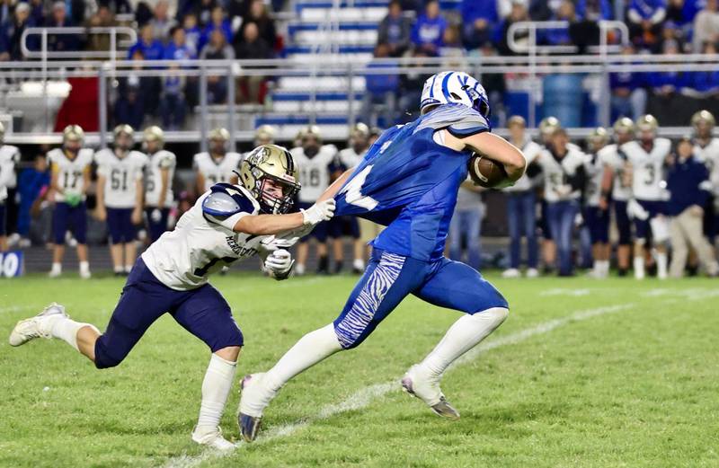 A Mercer County defender can only get a piece of Princeton's Casey Etheridge's shirt on the way to a touchdown in Friday's 57-20 win over Mercer County at Bryant Field.