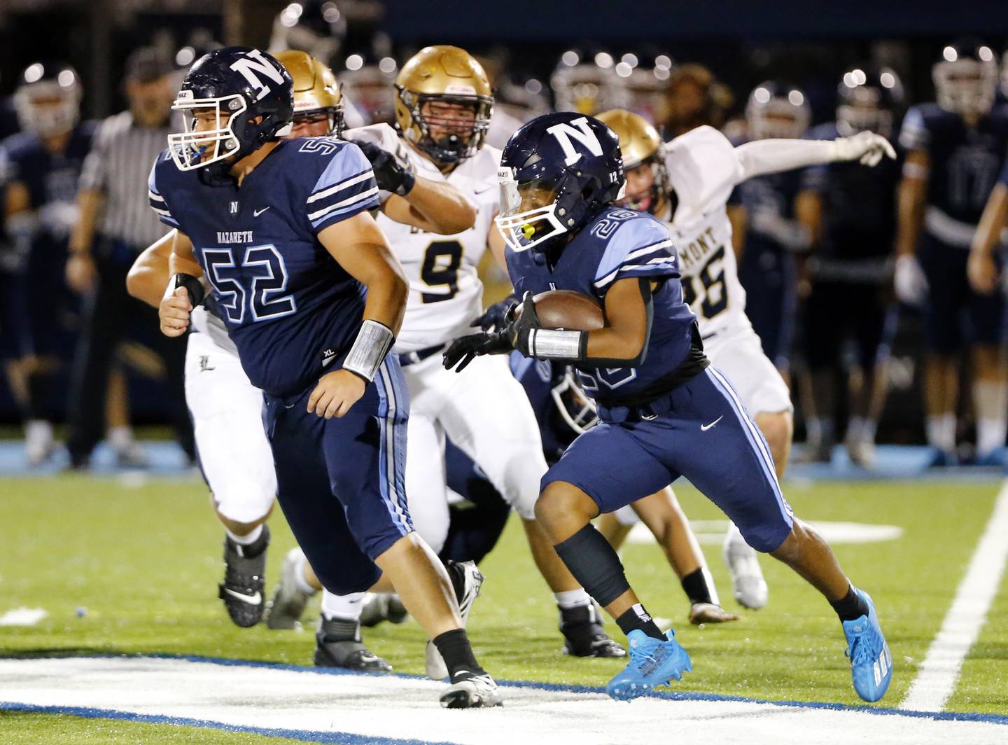 Nazareth Academy's #26 runs the ball during the boys varsity football game between Lemont High School and Nazareth Academy on Friday, Sept. 2, 2022 in LaGrange, IL.