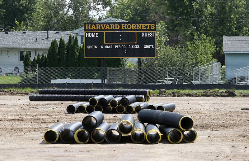 Construction continues on Thursday July 25, 2024 on the new artificial turf field at the Harvard Junior High School.