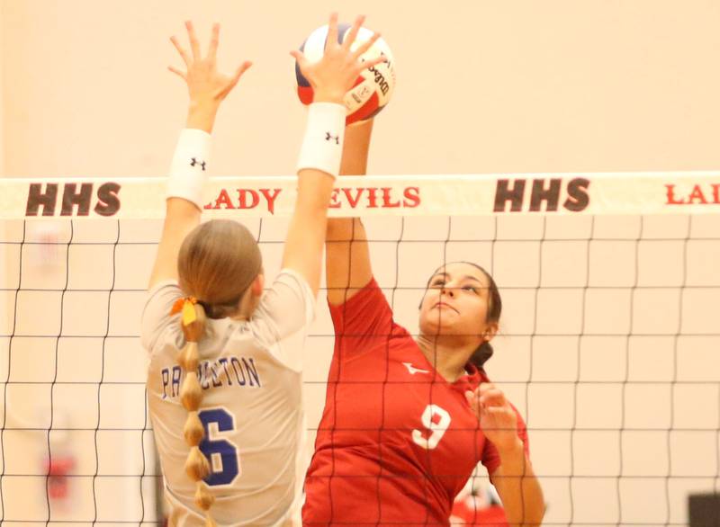 Princeton's Caroline Keutzer blocks a spike from Hall's Natalia Zamora on Tuesday, Sept. 17, 2024 at Hall High School.