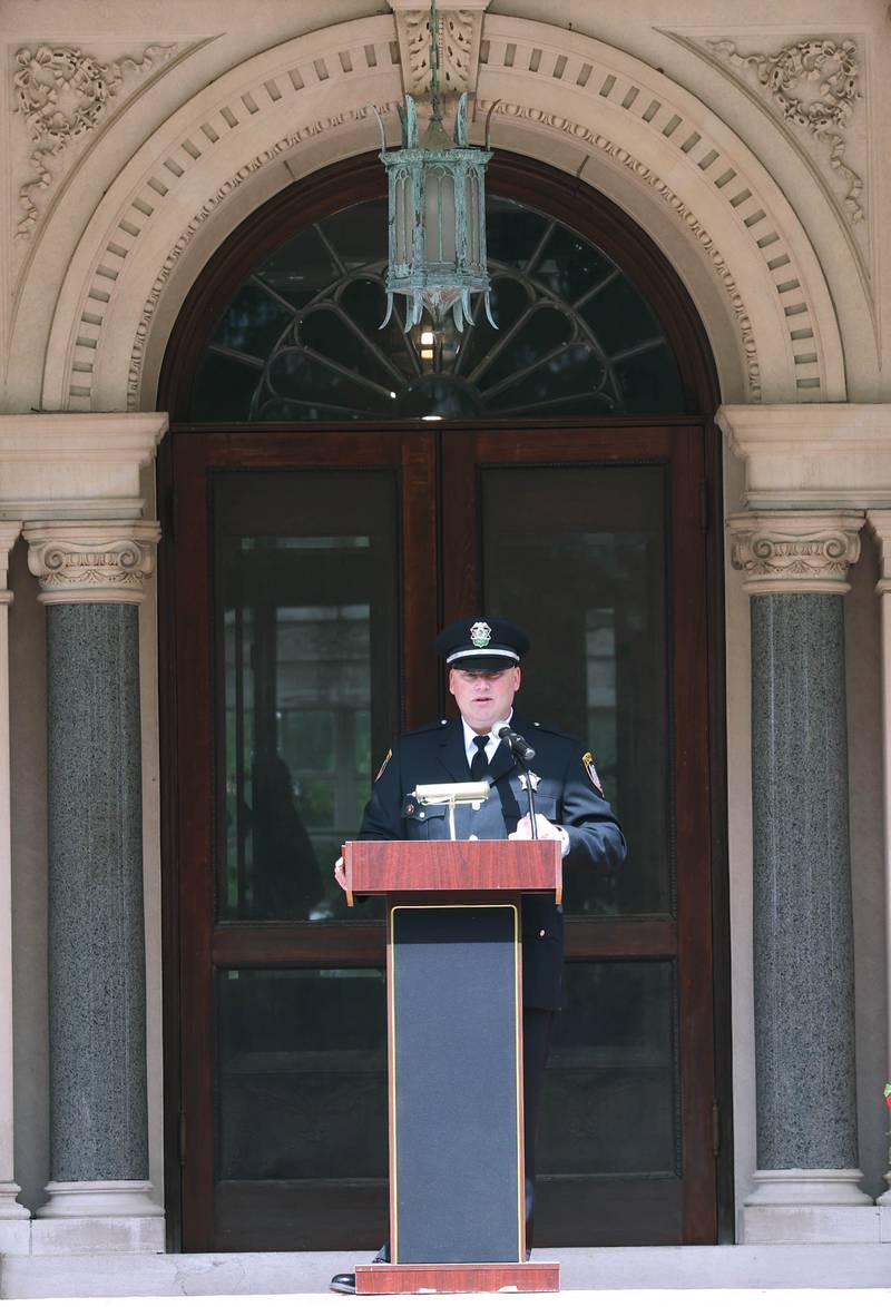 Keynote Speaker Jason Goodwin, a U.S. Marine Corps veteran and DeKalb police sergeant, makes his remarks Monday, May 27, 2024, during the DeKalb Memorial Day program at Ellwood House.