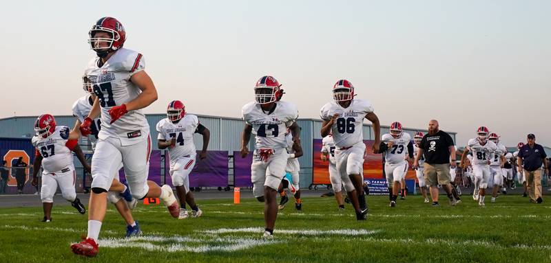 West Aurora takes the field prior to kick-off against Oswego during a football game at Oswego High School on Friday, Sept. 29, 2023.