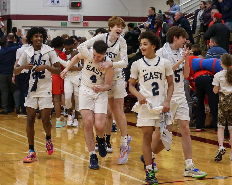 Oswego East celebrates after winning the Class 4A Lockport Regional final game over West Aurora.  Feb 24, 2023.