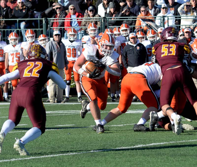 Byron's Caden Considine (37) runs for a gain against Lombard-Montini  in 3A semifinal action in Lombard on Saturday, Nov. 18, 2023.