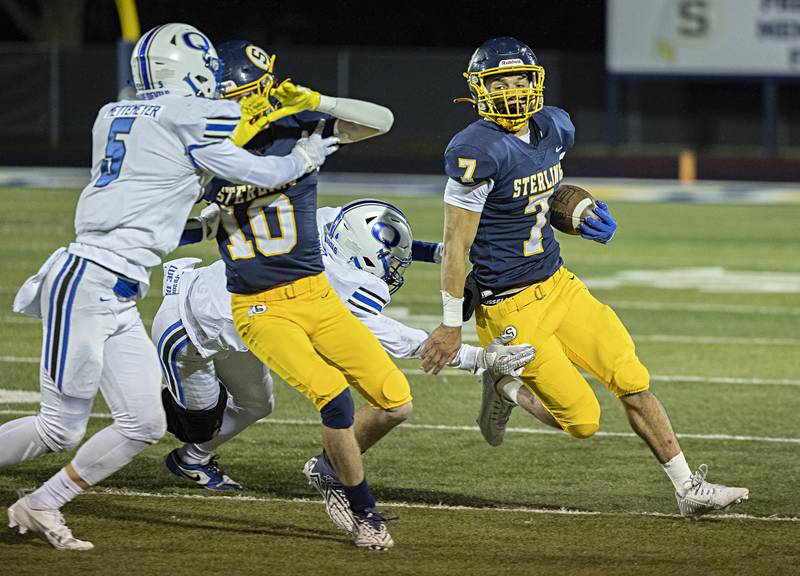 Sterling’s Andre Klaver looks for running room against Quincy Friday, Oct.6, 2023 in Sterling.