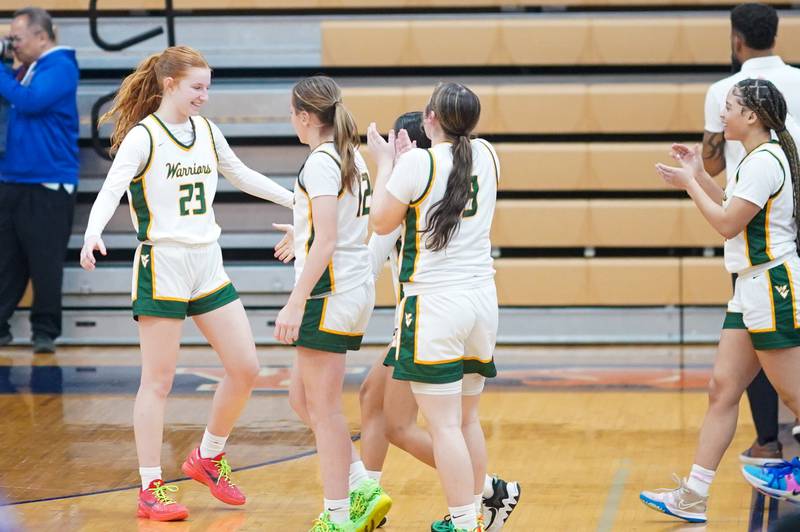 Waubonsie Valley players celebrate after defeating Downers Grove North to advance to the Oswego championship 4A sectional against Benet at Oswego High School on Tuesday, Feb 20, 2024.