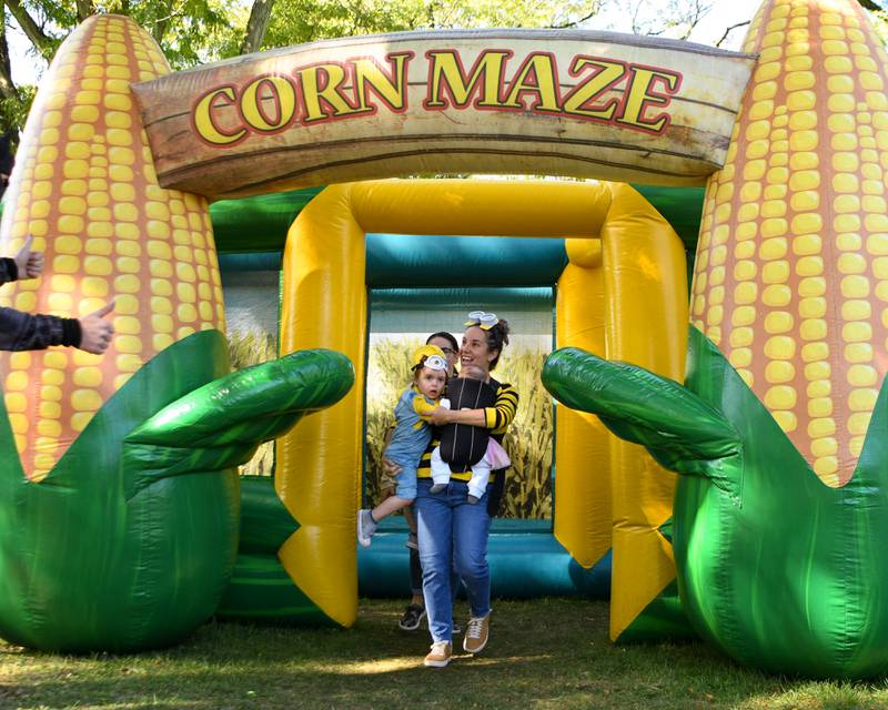 Minions Karen Mestek and her son Elliot Mestak, 2 years old, get a thumbs up after completing the corn maze during the Family Fall Fest held at Wild Meadows Trace Park in downtown Elmhurst on Saturday Oct. 7, 2023.