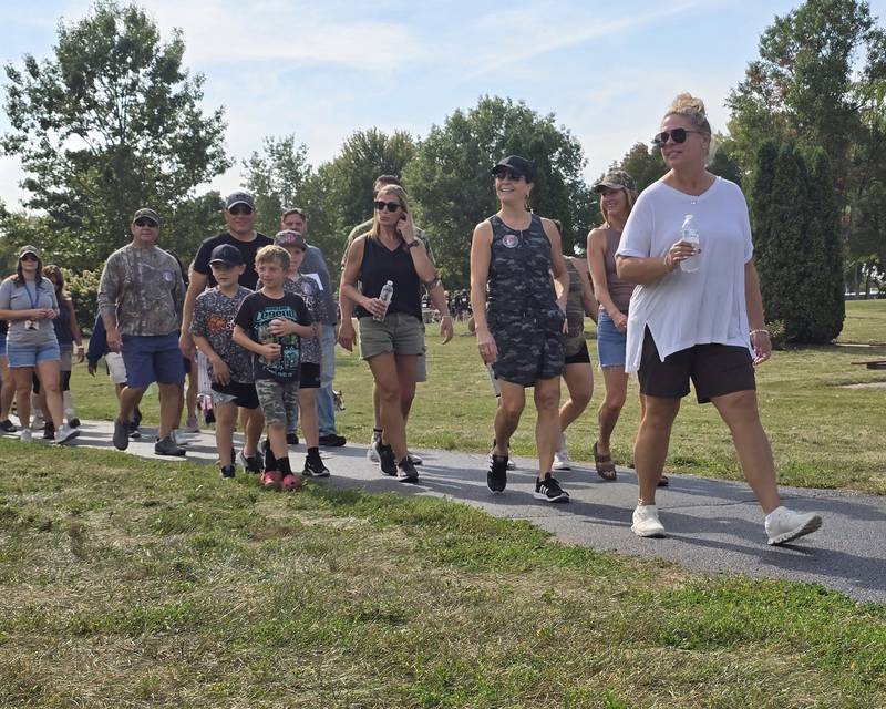 Walkers participate Sunday, Sept. 15, 2024, at the Compassionate Friends Walk to Remember at Baker Lake in Peru.