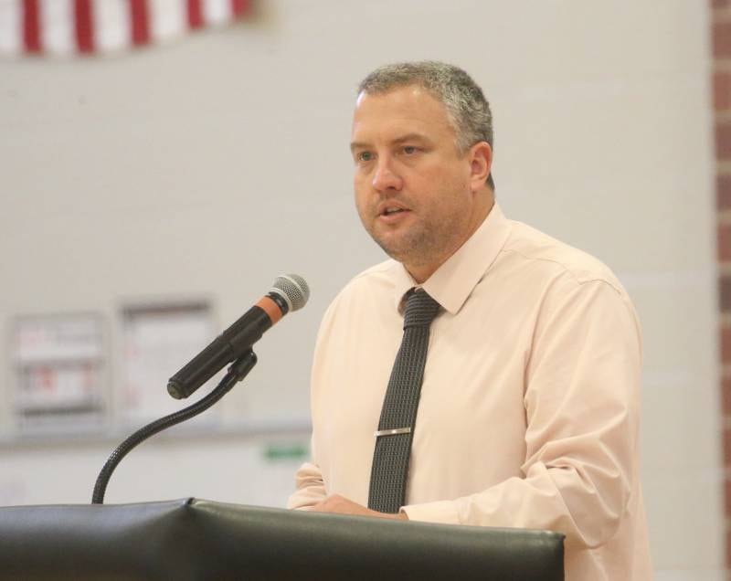 Wes Miller welcomes visitors during the Parkside Middle School Veterans Day Program on Friday, Nov. 10, 2023 at Parkside Middle School in Peru.