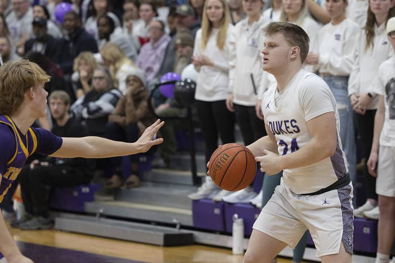 Dixon’s Eli Davidson looks to pass against Sherrard Thursday, Feb. 15, 2024 at Dixon High School.