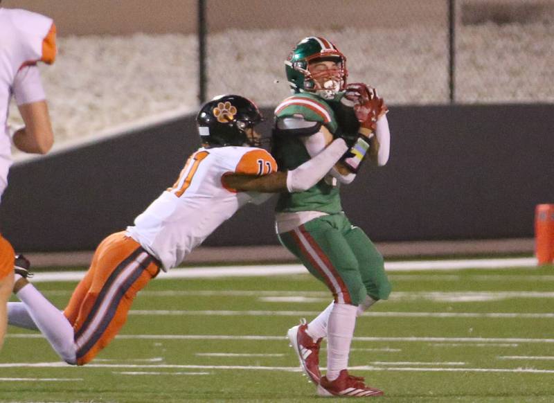 L-P's Adrian Arzola makes a catch over United Township's Jasiah Massey on Friday, Aug. 30, 2024 at Howard Fellows Stadium.