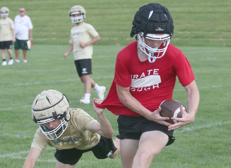 Ottawa's Owen Sanders makes a catch over St. Bede's Carson Riva during a 7-on-7 meet on Wednesday, July 24, 2024 at Ottwaa High School.