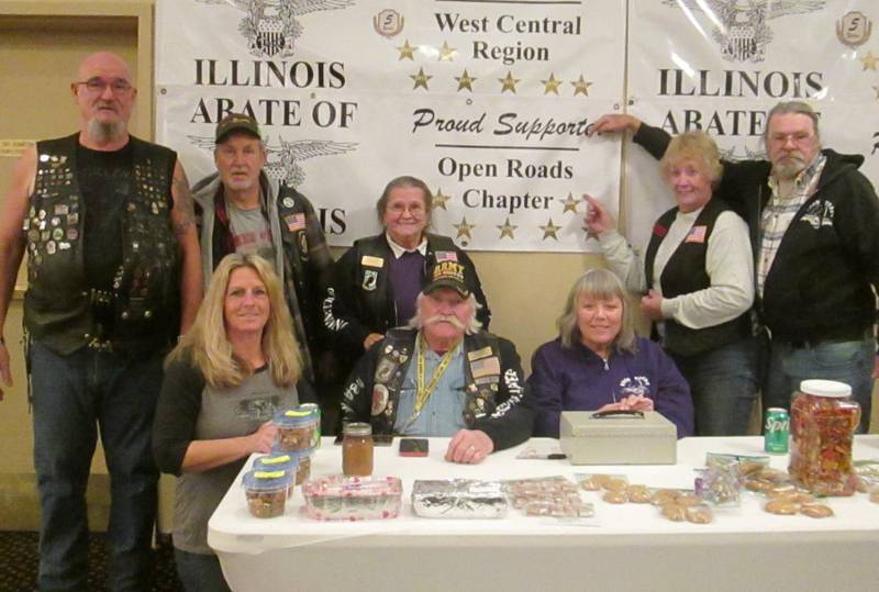 Open Roads ABATE Chapter members Sam and Sharyl Mataya, Bill and Sally Kolb, Cliff and Linda Oleson, Patti and Kevin Smith are pictured with the Open Roads Banner supporting State Seminar for eight consecutive years.