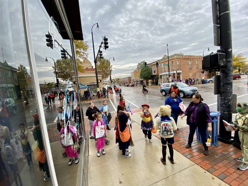 Costume-clad families took downtown DeKalb by storm Thursday, Oct. 26, 2023 for the 26th annual Spooktacular trick-or-treating event hosted by the DeKalb Chamber of Commerce.