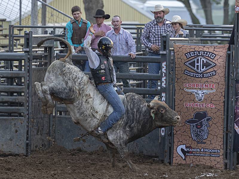 Ueberson Duarte starts his ride in the Rice Bull Riding and Barrel Racing event Thursday, August 11, 2023 at the Carroll County fair.