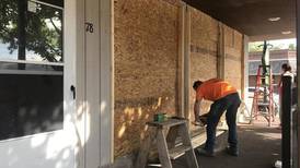 Photos: Downtown Oswego businesses board up windows to deter looters