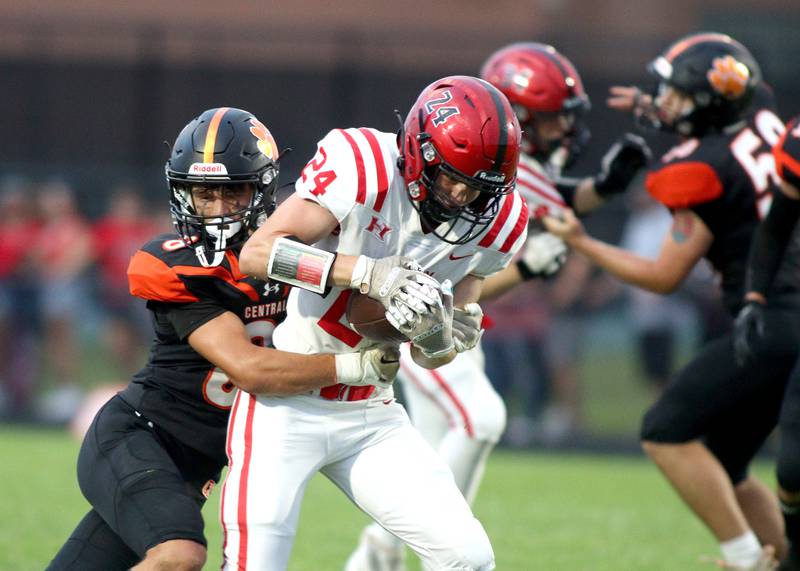 Huntley’s Gavin Havens runs the ball as Crystal Lake Central’s Tanner Bennett tackles in varsity football on Friday, Aug. 30, 2024, at Metcalf Field on the campus of Crystal Lake Central High School in Crystal Lake.