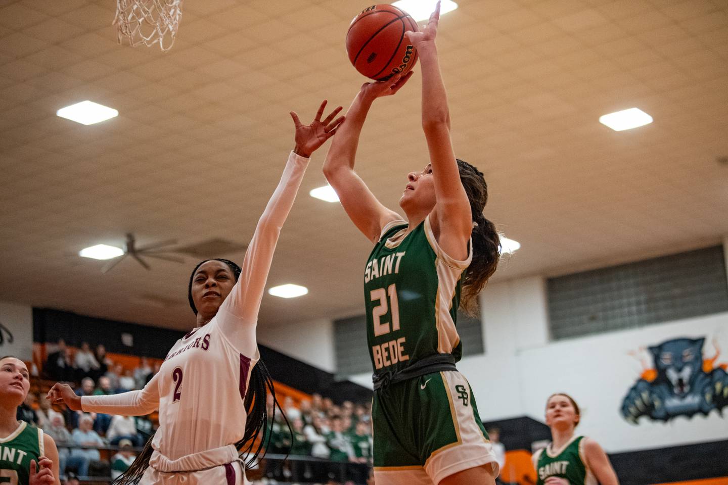 St Bede's Lily Bosnich lays up a shot as Morgan Park's Anna Sheppard attempts to defend during the 1A Sectional game on Tuesday Feb. 20, 2024 at Gardner-South Wilmington High School in Gardner