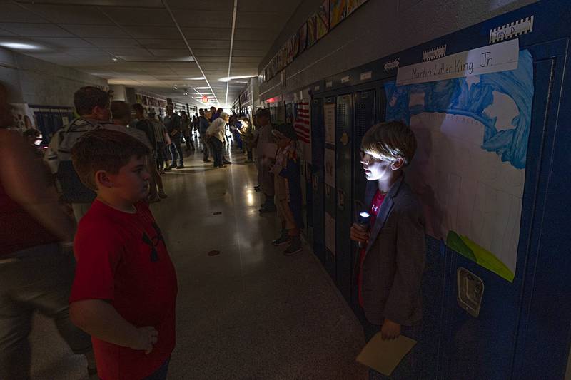 Washington School third-grader Bennett Shore (right) recites his research on Martin Luther King on Thursday, May 16, 2024, during a wax museum style-presentation at the school.