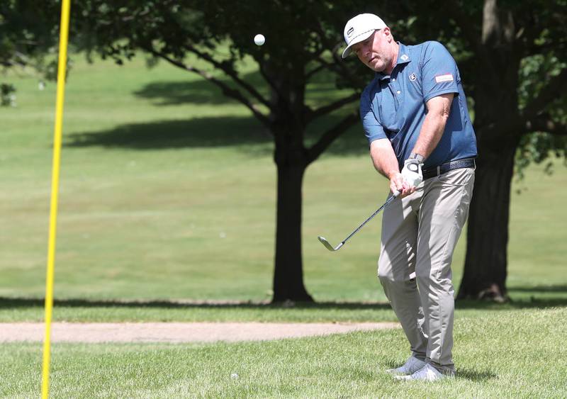 David Paeglow, head golf pro at Kishwaukee Country Club, chips onto the 18th green Thursday, June 6, 2024, at the country club in DeKalb. Paeglow will be competing in the U.S. Senior Open later this month.