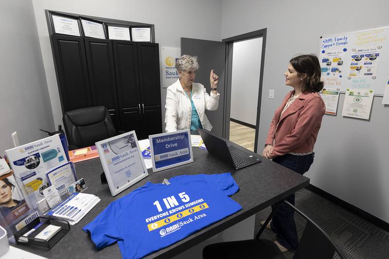 Susan Hamstra (left), treasurer for NAMI Sauk Area, speaks with Andrea Wright Friday, April 12, 2024, in the new office for the National Alliance  for Mental Illness Sauk Area.