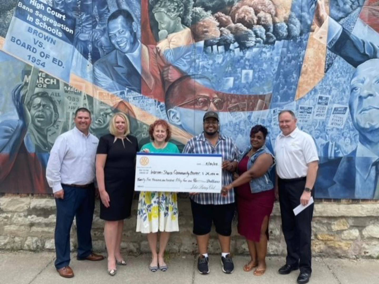 The Rotary Club of Joliet donated this year's raffle proceeds to the Warren Sharpe Community Center in Joliet. Pictured (from left) are Marc Gorsch, Tracy Simons, Mary Sheehan, Jeremy Bolden (executive director of Warren Sharpe), Daphne Payton (from Warren Sharpe) and Brian Cedergren.