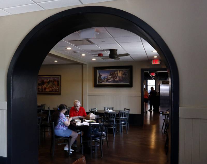 People dine at the Public House of Woodstock on Aug. 29, 2023, shortly after the restaurant reopened following a renovation of the city-owned Old Courthouse on Woodstock Square.