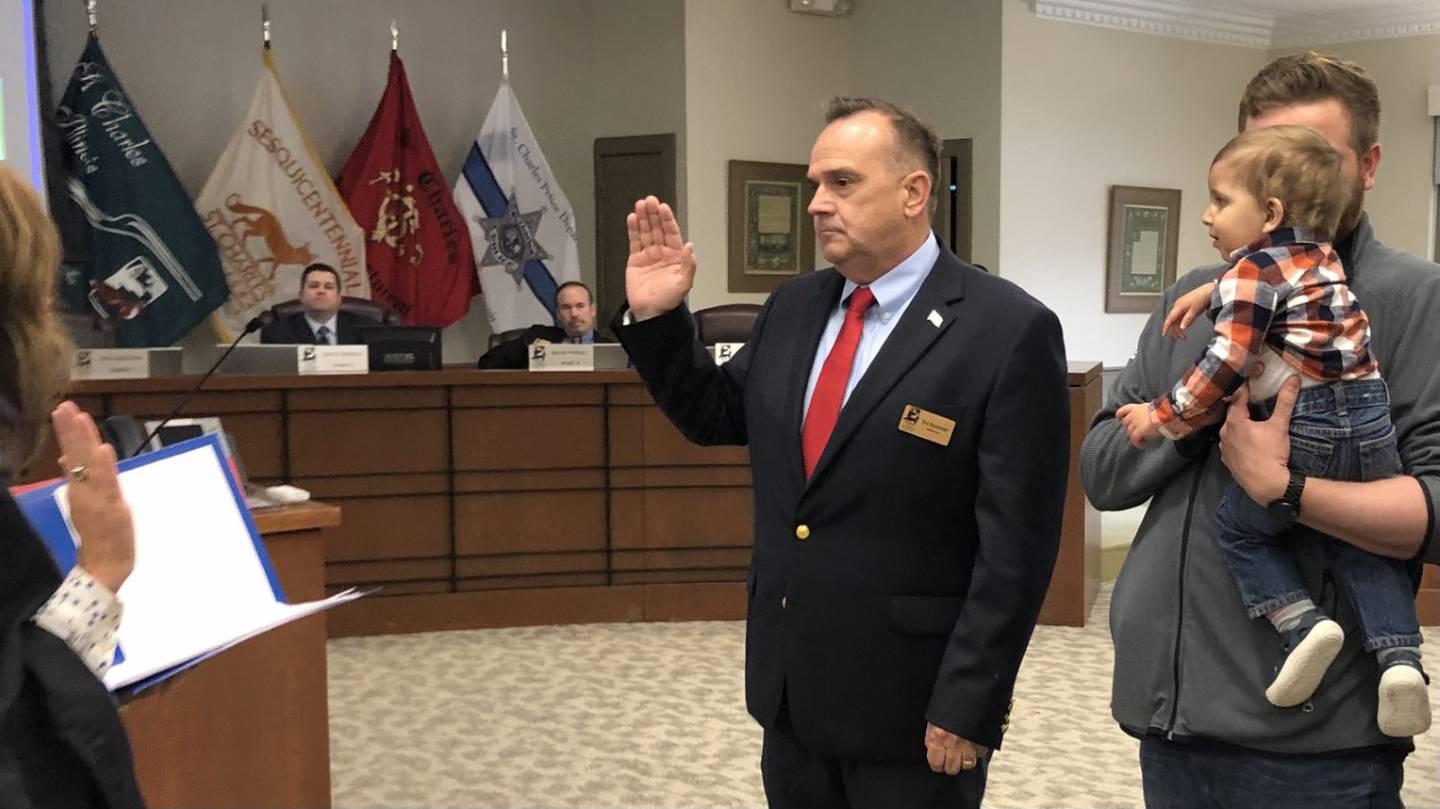 Ed Bessner being sworn in alongside his family Monday May 1, 2023, as Ward 5 Alderperson by the honorable Judge Elizabeth Flood at St Charles City Council meeting at 2 Main St.