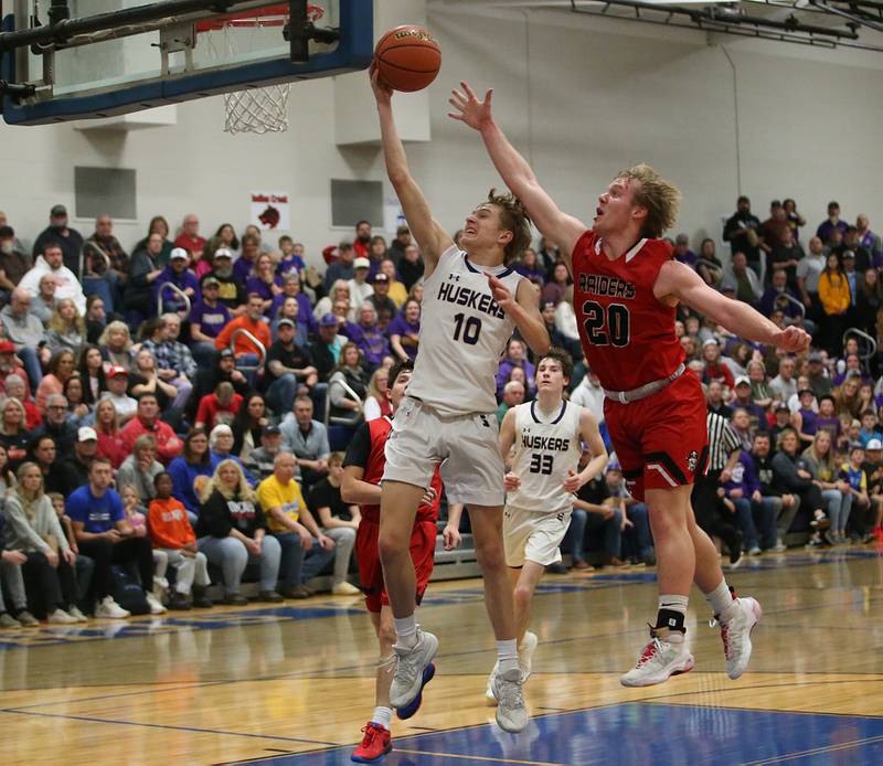 Serena's Carson Baker scores on a layup as Earlville's Griffin Cook defends during the Little Ten Conference Championship on Friday, Feb. 2, 2024 at Somonauk High School.