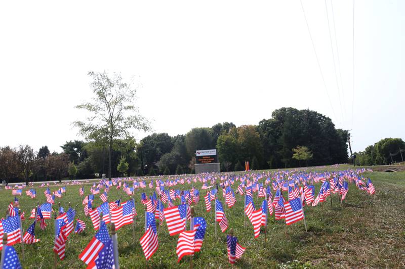 Waltham School placed 2,977 flags outside the school lawn to remember the lives lost in the 9/11 attacks on Monday, Sept. 11, 2023 in Utica.