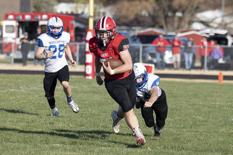 Amboy’s Quinn Leffelman picks up yards in the second quarter of the Clippers’ first round playoff game Saturday, Oct. 29, 2022 against Blue Ridge.