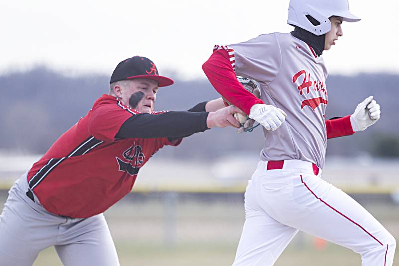 Amboy’s Landon Montavon tags out Oregon’s Nole Campos Thursday, March 21, 2024 in Oregon.