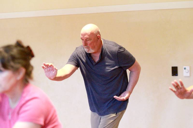 Lee Molitor of St. Charles, who is in remission for bladder cancer, participates in a tai chi class for cancer patients, survivors and caregivers at the Northwestern Medicine Living Well Cancer Resource Center in Geneva.