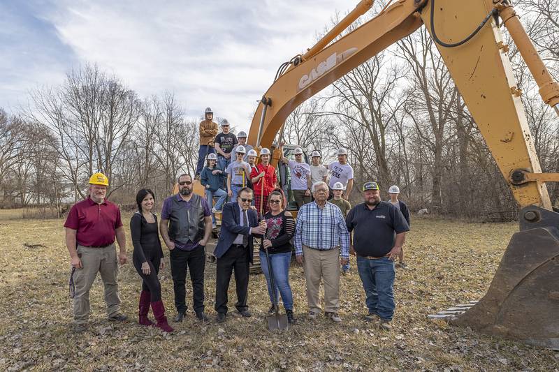 Developers, contractors and WACC students pose for a photo at one of two areas in Rock Falls Tuesday, Feb. 27, 2024 where dozens of single family homes are slated to be built. Pictured: WACC building trades teacher Matthew Hicks (left), Justice Castro, Brandon Morris, Louis Pignatelli, Amber Hoffman, mayor Rod Kleckler and Jud Ellmaker.