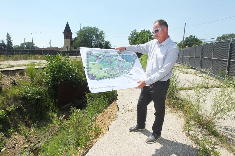 Jim Keim, village administrator, holds the plan rendering of the Downtown Community Open Space Redevelopment Project at the construction site of the village owned property at Main & Orchard in Antioch on July 10th, 2023. The groundbreaking ceremony for the new park will take place on July 28th at 11:00am.
Candace H. Johnson for Shaw Local News Network