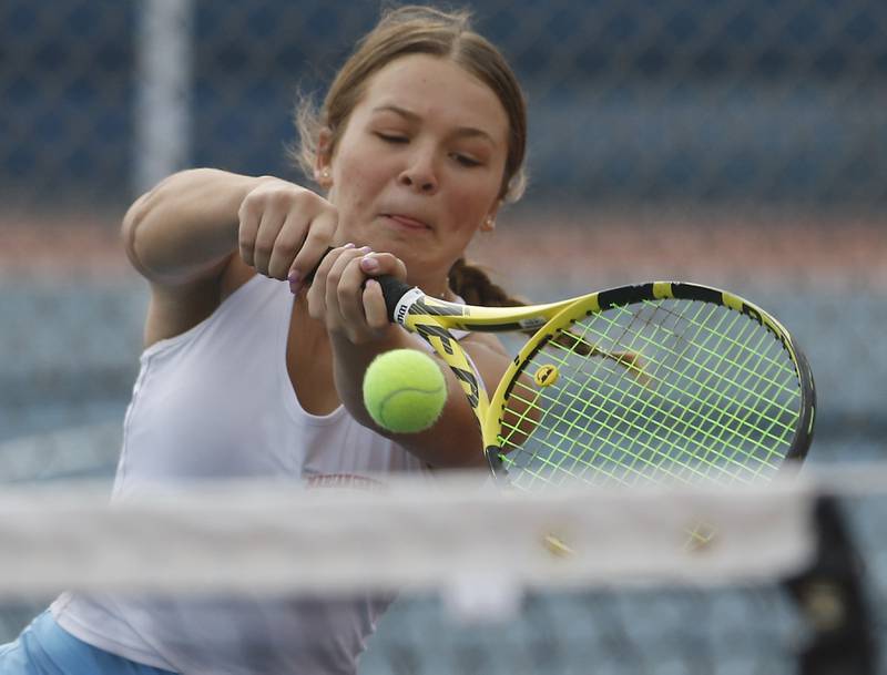 Marian Central’s Jenna Remke returns the ball Thursday, Oct. 19, 2023, during doubles match on the first day of the IHSA State Girls Tennis Tournament at Hoffman Estates High School in Hoffman Estates.