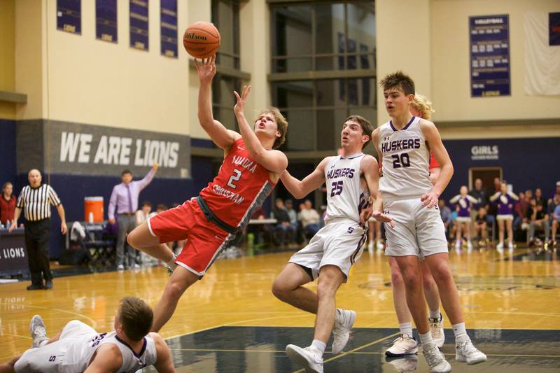 Aurora Christian's Cam Morel drives to the basket against Serena at the Class 1A Boy's Basketball  Super Sectional on Friday , March 1, 2024 at Harvest Christian Academy  in Elgin.