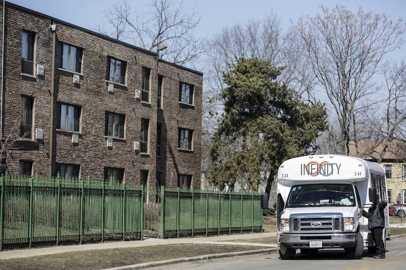 A bus carrying members of a jury arrives at Evergreen Terrace on March 11. Evergreen Terrace owners have filed notice they intend to appeal rulings that allow Joliet to acquire the low-income housing project for $15 million.