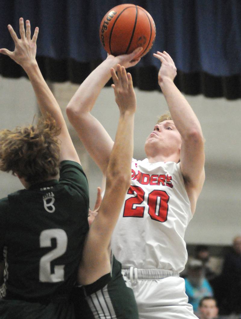 Earlville's Griffin Cook (20) shoots past St. Bede's Kaden Nauman (2) in the Marquette Christmas Tournament on Tuesday, Dec. 26, 2023.