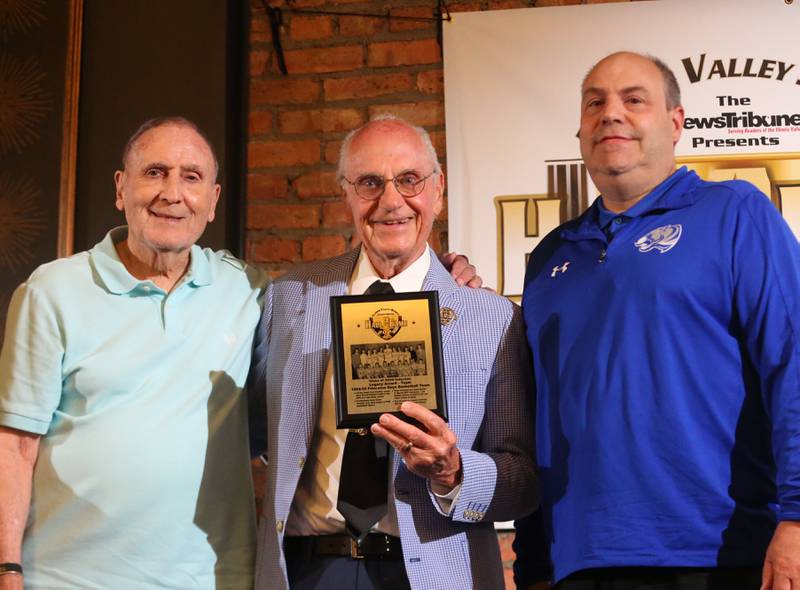 John Smith, Lanny Slevin and Jeff Olson pose for a photo with a plaque for the 1954-1955 Princeton boys basketball team during the Illinois Valley Sports Hall of Fame awards banquet on Thursday, June 6, 2024 at the Auditorium Ballroom in La Salle.