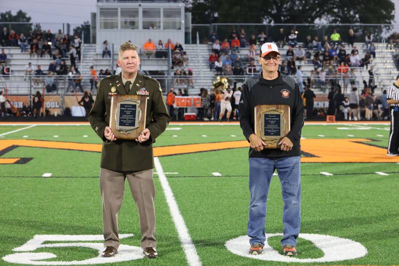 McHenry High School recognized alumni Robert J. Heatherly, Class of 1998, left, and David Lawson, Class of 1974, as the most recent Distinguished Graduate honorees during the Sept. 29, 2023 homecoming game.