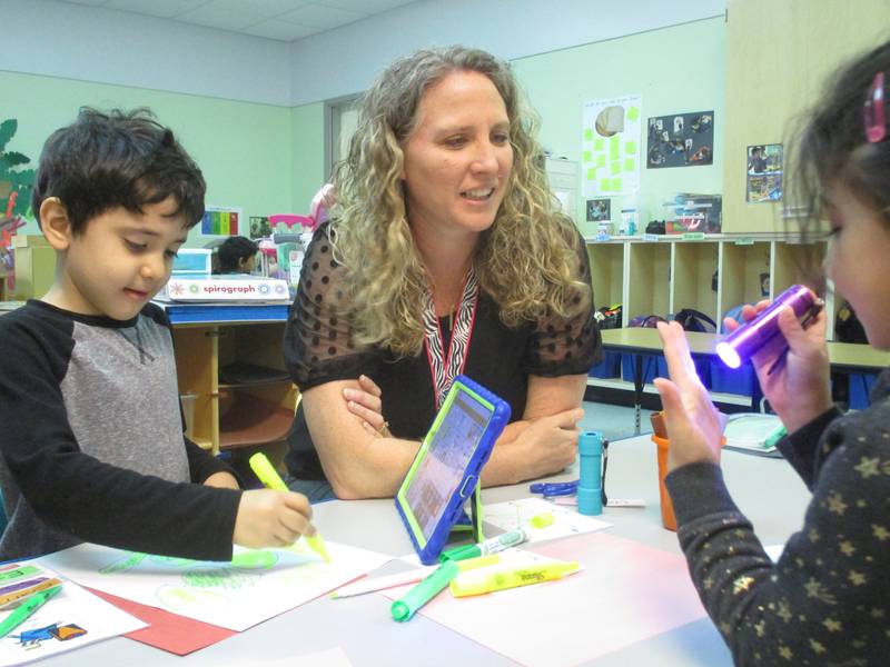 Preschool teacher Gretchen Wheatley works with her students at Brokaw Early Learning Center in Oswego School District 308.