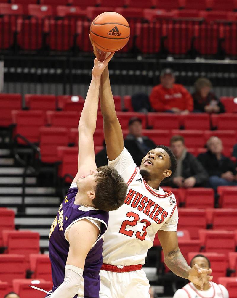 Northern Illinois Huskies forward Harvin Ibarguen and Albany Great Danes forward Jonathan Beagle go after a rebound during their game Tuesday, Dec. 20, 2022, in the Convocation Center at NIU in DeKalb.