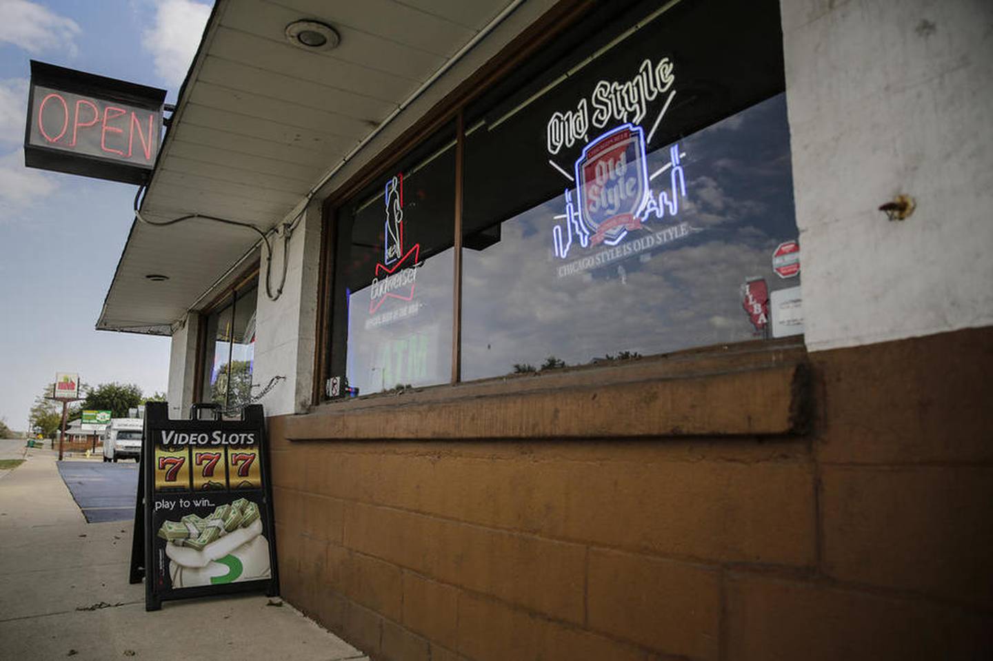 A sign sits outside Izzy's bar advertising the video gambling machines Thursday in Joliet.