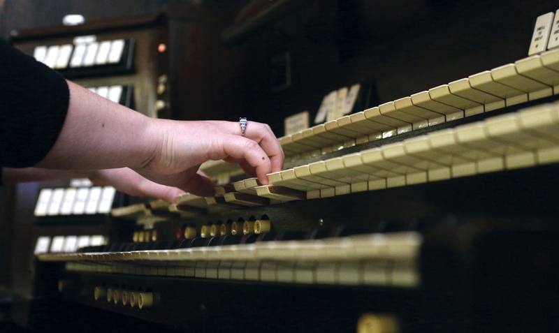 Delle Vercimak, business manager for Illinois Valley Youth Symphony Orchestra, practices on the 1928 Aeolian Duo-Art Organ in La Salle-Peru Township High School’s Matthiessen Auditorium. Vercimak will accompany the youth symphony on the vintage organ during a concert Sunday.