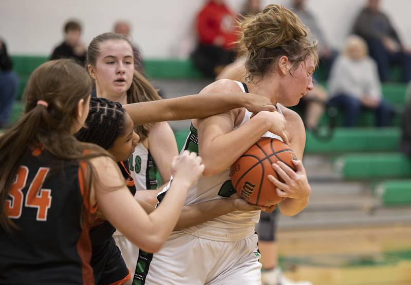 Rock Falls’ Claire Bickett wrestles the ball away from a player Wednesday, Jan. 4, 2023 against Byron.