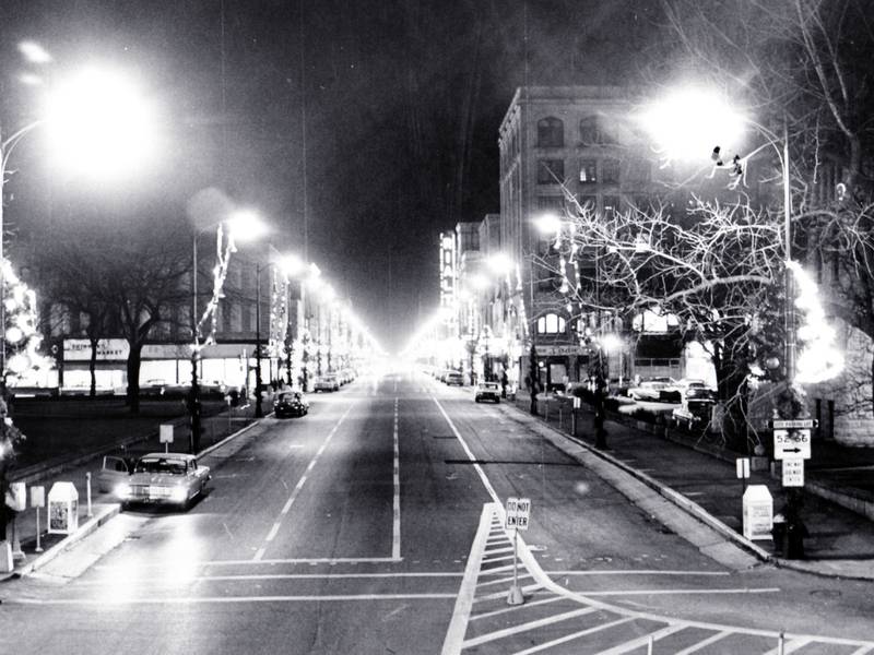 Chicago Street in downtown Joliet with Christmas tree and lights circa 1960.